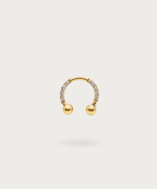 piercing snug a forma di ferro di cavallo in titanio dorato