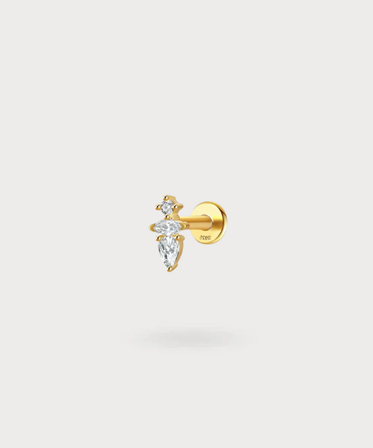 Piercing forward helix Ariadni, una cascata di zirconi in oro per un'eleganza classica.