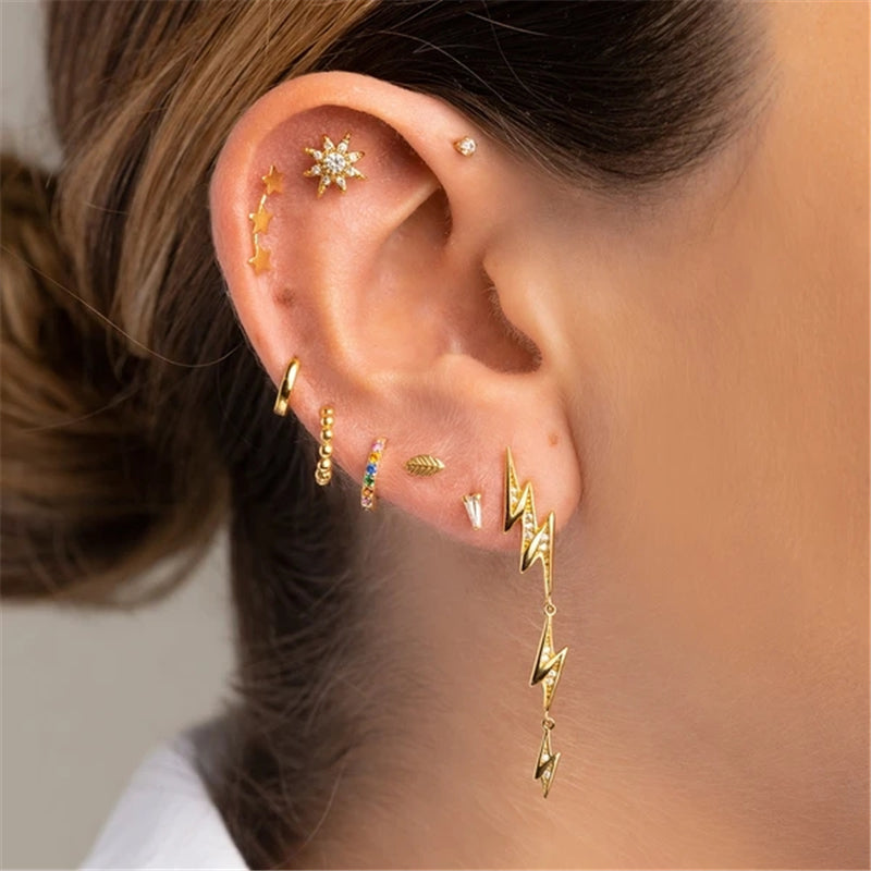 piercing Forward Helix sole dorato con zirconi su donna