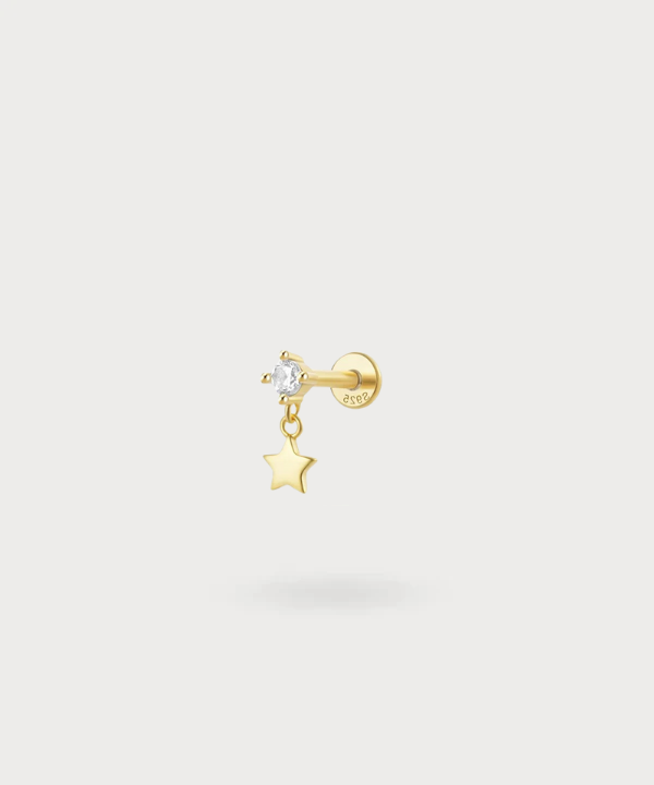 Piercing flat Leire con una stella dorata o argentata e una zircone luminosa
